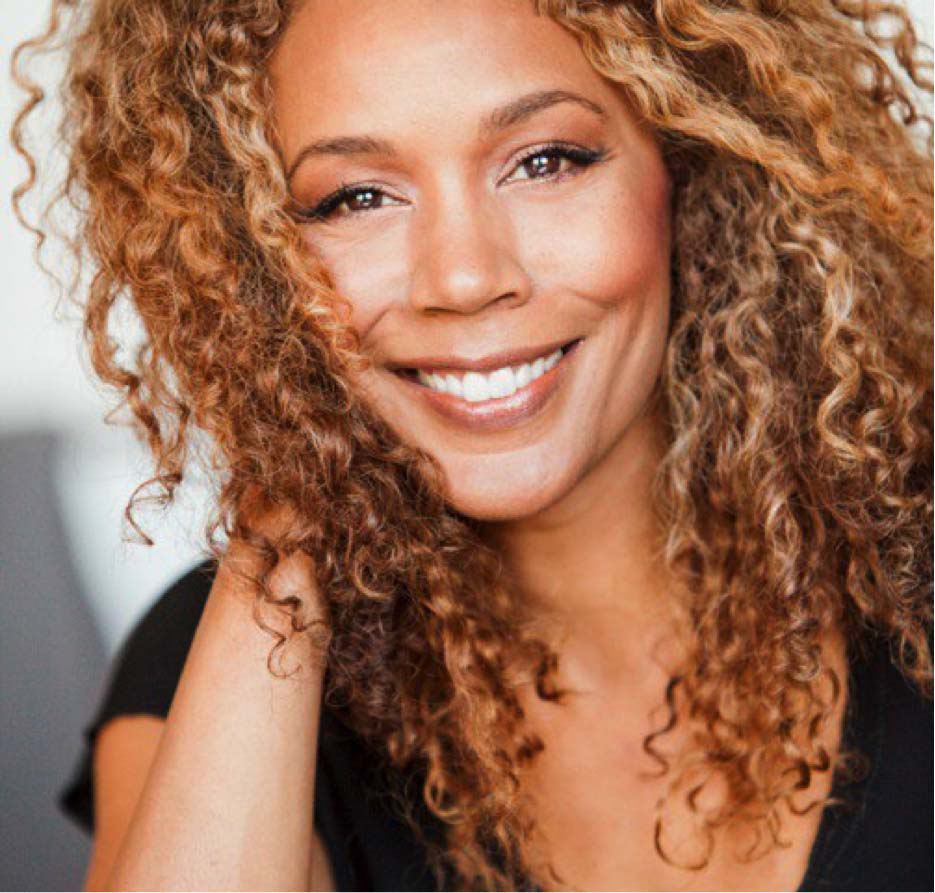 Image of Rachel True in a black shirt smiling