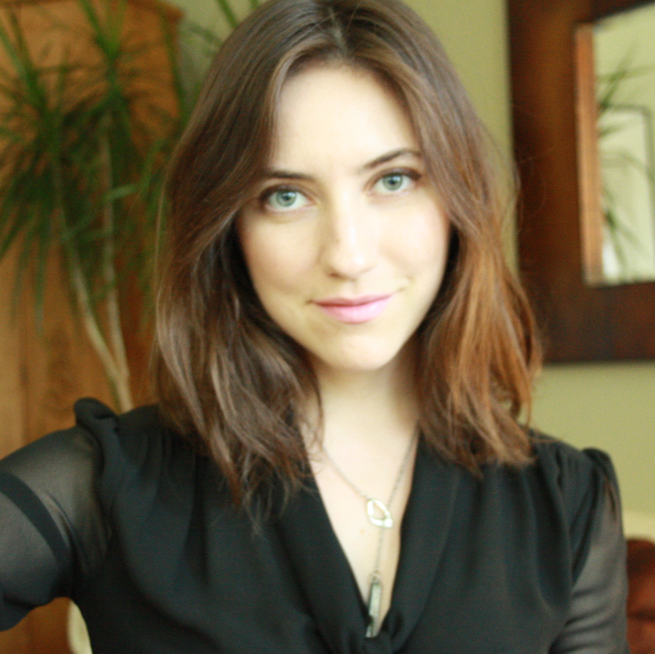 Sharday Mosurinjohn in a black shirt smiling