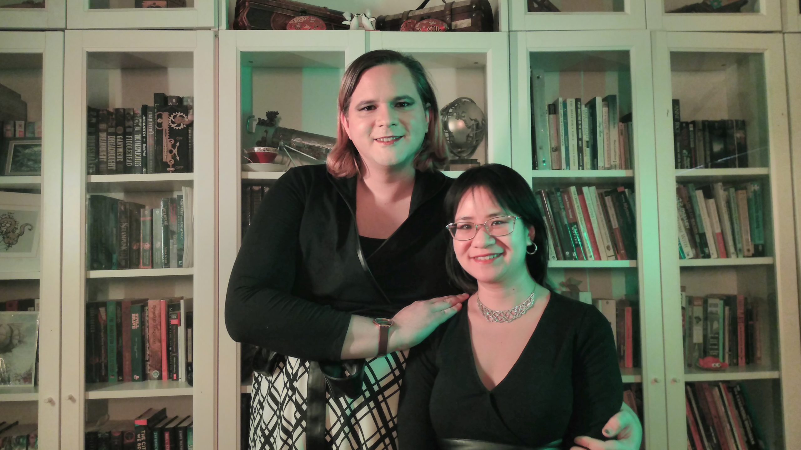 Diana M. Pho and Ashley Rogers in front of a bookcase smiling at the camera